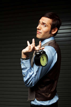 Well Dressed Man holding a clock.