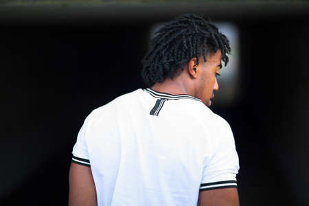 Rear view of a young handsome African American man.