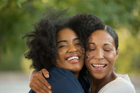 Mother hugging her daughter at her graduation.