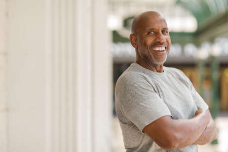 Happy mature African American man smiling outside.の写真素材