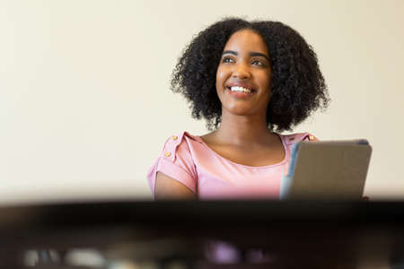 Portrait of African American business woman at work.