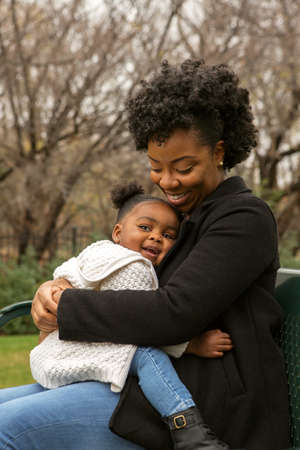 Happy African American mother and her daugher.の写真素材