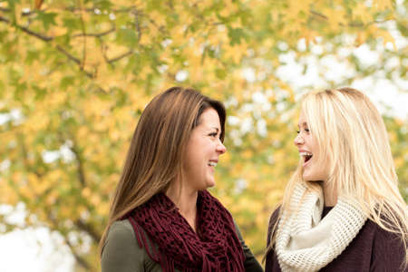 Portrait of a mother and daughter hugging.