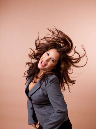 Beautiful Hispanic woman dancing on an isolated background.の写真素材