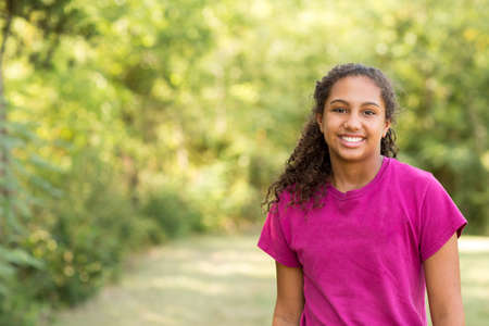 Young happy teen girl laughing and smiling.の写真素材