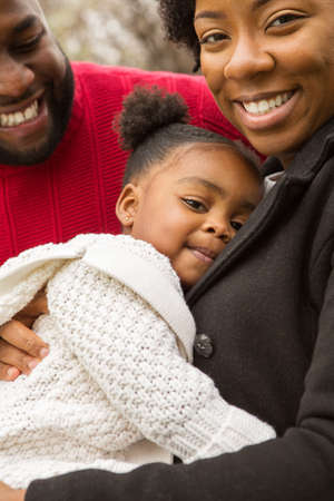 Happy African American family with their baby.