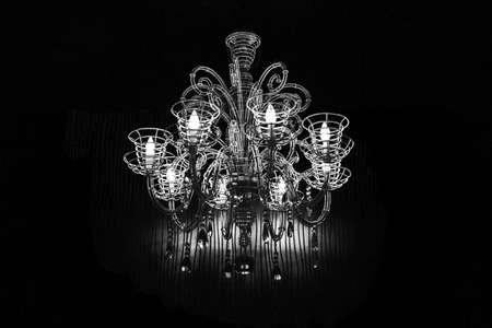 White and black chandelier background with copy space.の写真素材