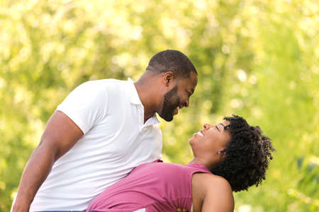 Happy African American couple laughing and smiling.