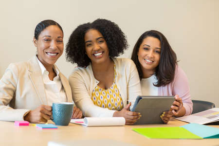 Multi ethnic group of women at work.