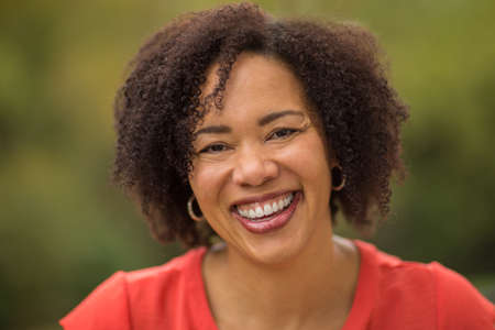 Confident Happy African American Woman Smiling Outsideの写真素材