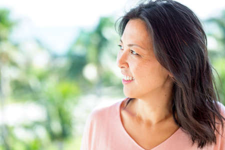 Portrait of a beautiful Asian woman smiling.の写真素材