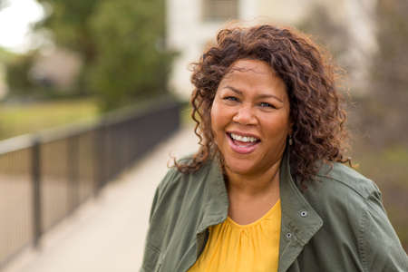 Beautiful mature African American woman smiling and laughing.
