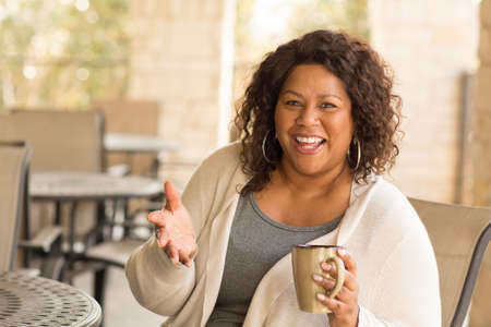Beautiful mature African American woman smiling and laughing.の写真素材