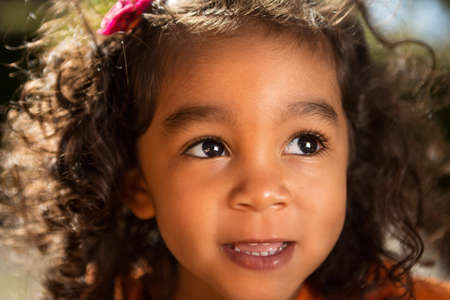 Close up of a little girl playing at the park.の写真素材