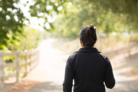 Portrait of a fit Asian woman exercising.の写真素材