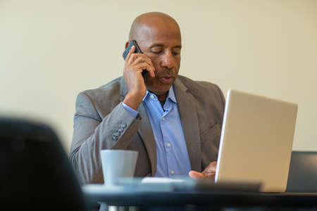 African American man having a difficult time at work.
