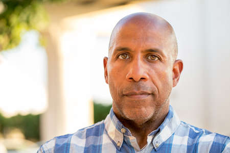 Happy mature African American man smiling outside.の写真素材