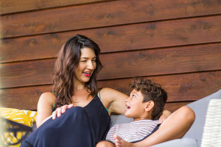 Portrait of a young Hispanic Mother and her son.の写真素材