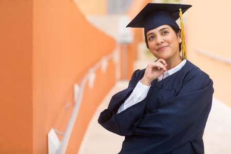 Young hispanic female graduate at her graduationの写真素材