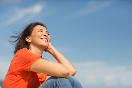 Portrait of a happy confident Asian woman smiling.の写真素材