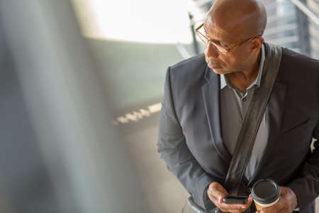 Portrait of a mature handsome African American businessman outside.の写真素材