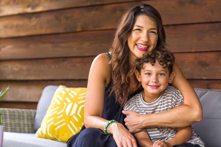Portrait of a young Hispanic Mother and her son.の写真素材