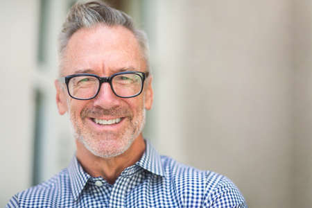 Mature handome fit man sitting outside stock photo