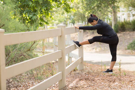 Portrait of a fit Asian woman exercising.の写真素材