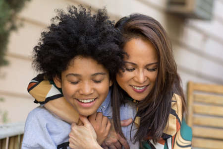Portrait of an Asian mother with her teenage son.の写真素材