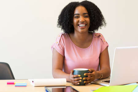 Portrait of African American business woman at work.の写真素材