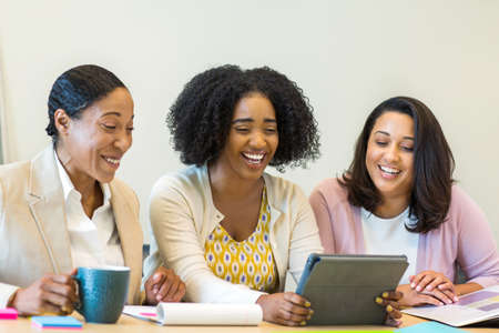 Multi ethnic group of women at work.の写真素材