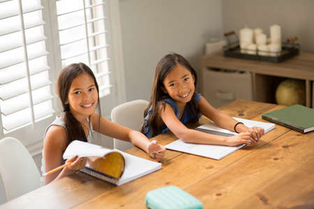 Young Girls Working On Their School Work