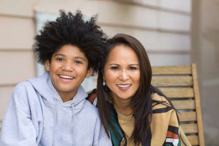 Portrait of an Asian mother with her teenage son.