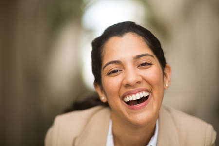 Hispanic business woman smiling outside stock photoの写真素材