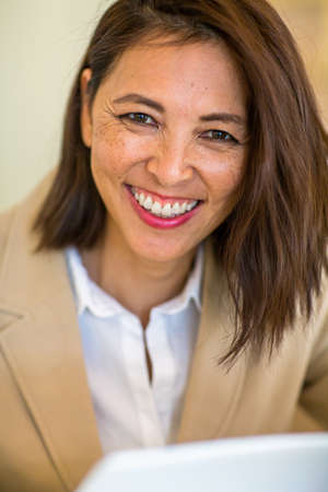 Portrait of a confident Asian businesswoman smiling.の写真素材
