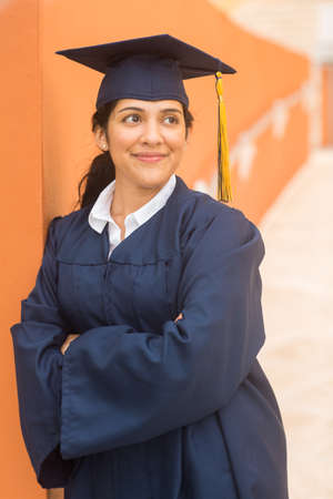 Young hispanic female graduate at her graduationの写真素材