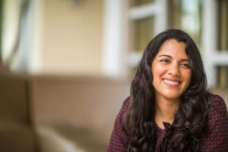 Confident Hispanic woman laughing and smiling stock photoの写真素材