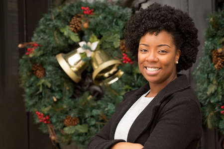 African American woman smiling outside at Christmas.の写真素材