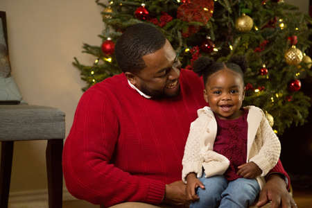 Happy African American father and his daughter.の写真素材