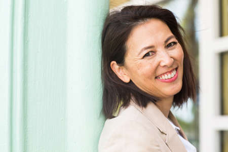 Portrait of a confident Asian businesswoman smiling.の写真素材