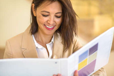 Portrait of a confident Asian businesswoman smiling.の写真素材