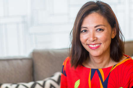Portrait of a mature confident Asian smiling.の写真素材