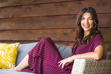 Portrait of a beautiful Hispanic woman smiling.の写真素材