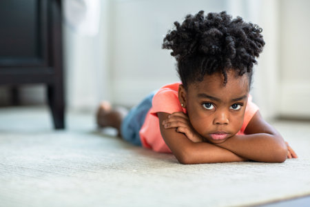 Young African American little girl upset and pouting.の写真素材