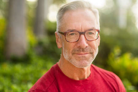 Mature handome fit man sitting outside stock photoの写真素材