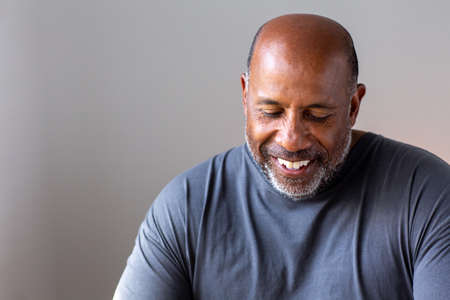 Portrait of a mature man smiling looking the camera.の写真素材