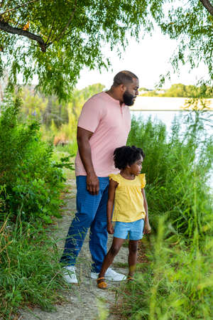 Happy father and his beautiful daughter smiling.の写真素材
