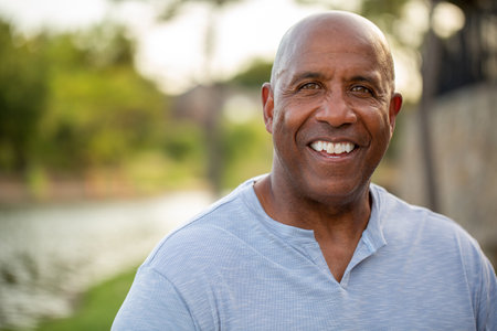 Portrait of an African American man standing in nature.の写真素材