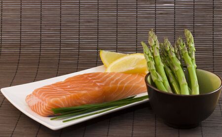 photo of a fresh slice of salmon with asparagusの写真素材
