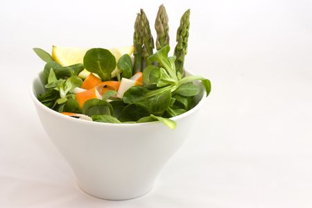 a cup of salad with surimi and asparagusの写真素材